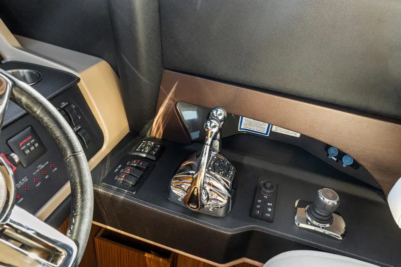 Slide: The Image of 2017 Sea Ray L590 Sport yacht control panel with throttle and joystick. - 20