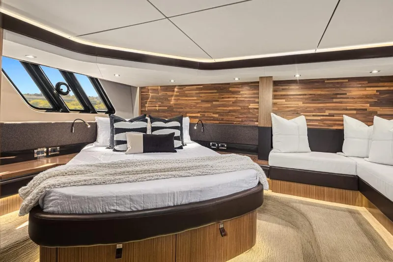 Slide: The Image of Luxurious 2017 Sea Ray L590 Sport yacht bedroom with modern design and elegant wood accents. - 24