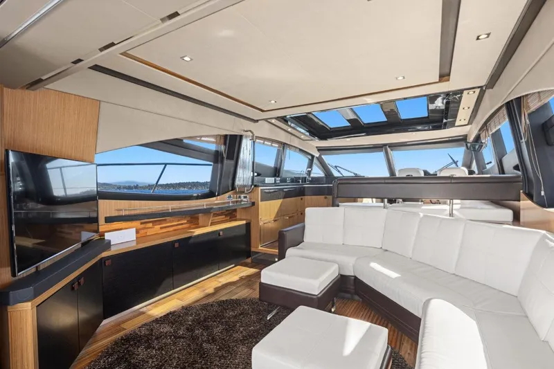 Slide: The Image of Luxurious interior of 2017 Sea Ray L590 Sport yacht with modern furnishings and panoramic windows. - 3