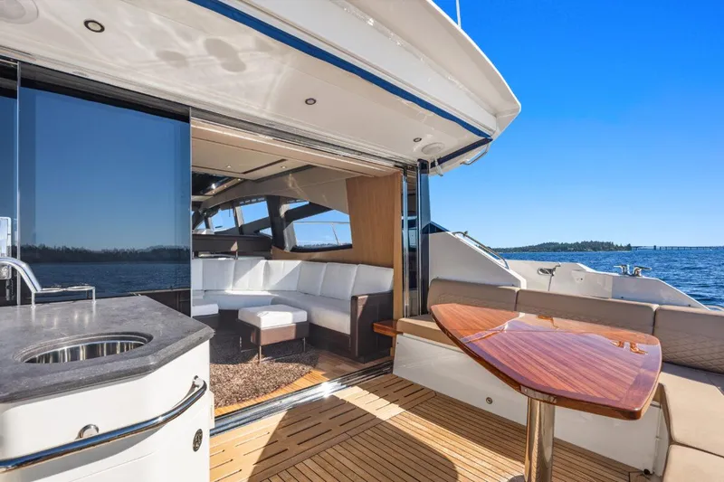 Slide: The Image of Luxurious 2017 Sea Ray L590 Sport yacht with elegant interior and scenic ocean view. - 35