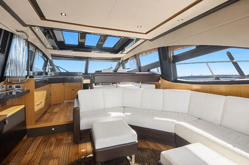 Slide: The Image of Luxurious interior of 2017 Sea Ray L590 Sport yacht with panoramic windows and plush seating. - 4