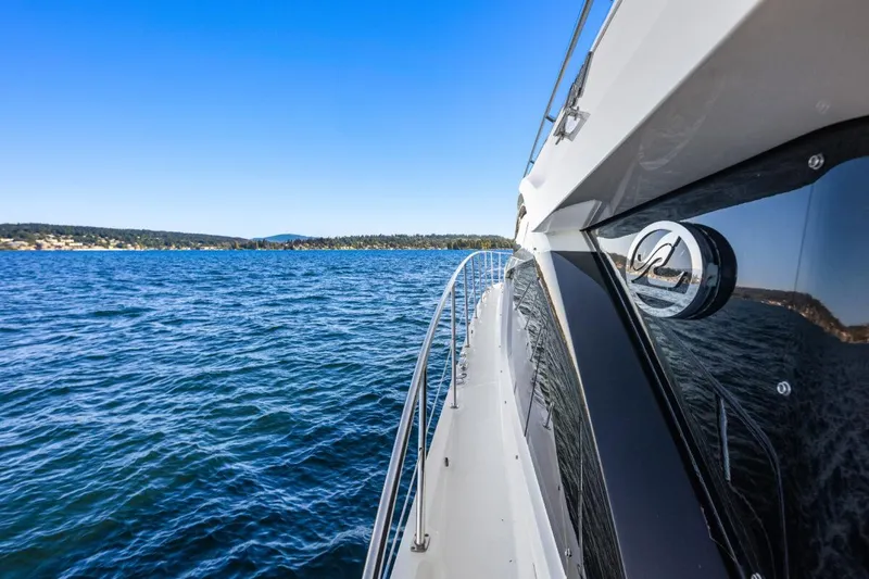 Slide: The Image of 2017 Sea Ray L590 Sport yacht cruising on open water. - 42