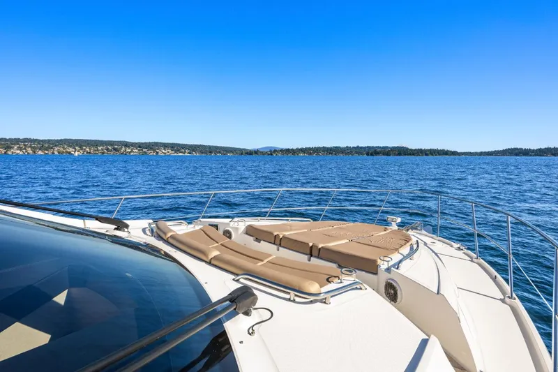 Slide: The Image of 2017 Sea Ray L590 Sport yacht on open water, clear blue sky. - 45