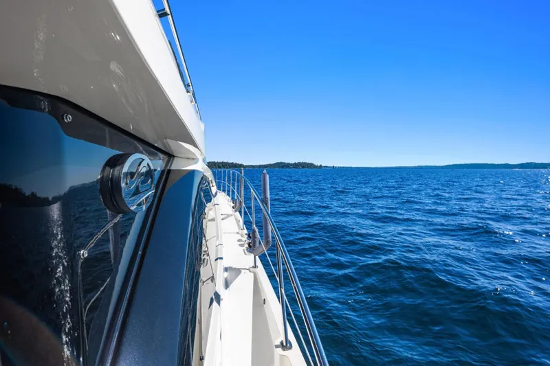 Slide: The Image of 2017 Sea Ray L590 Sport yacht cruising on open blue sea. - 46