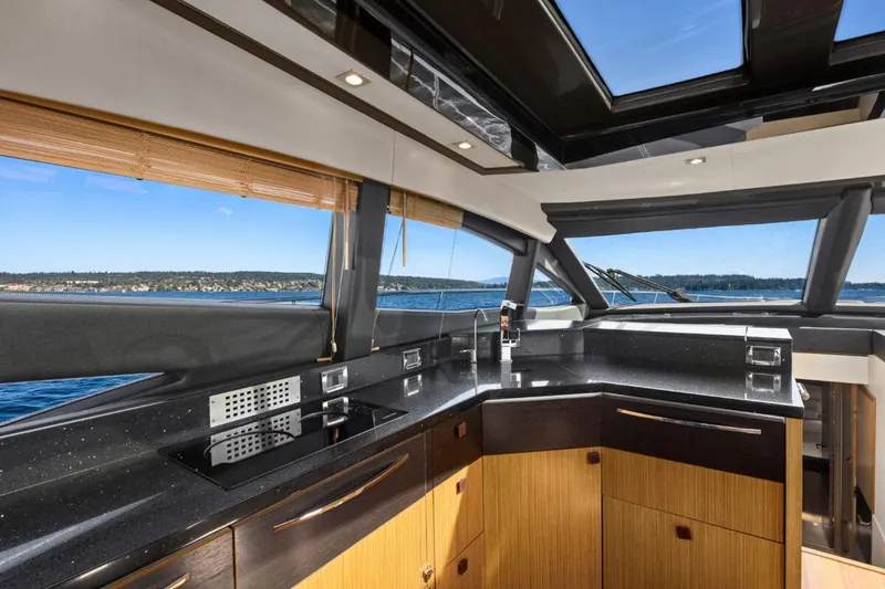 Slide: The Image of Luxurious interior of 2017 Sea Ray L590 Sport yacht with modern kitchen design. - 8