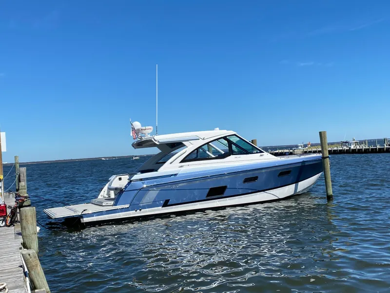 The Image of 2020 Formula 380 Super Sport Crossover boat docked on a sunny day. - 0
