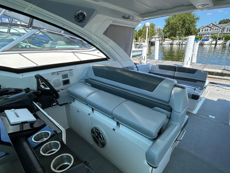 Slide: The Image of 2020 Formula 380 Super Sport Crossover interior with sleek seating and modern design at a marina. - 14