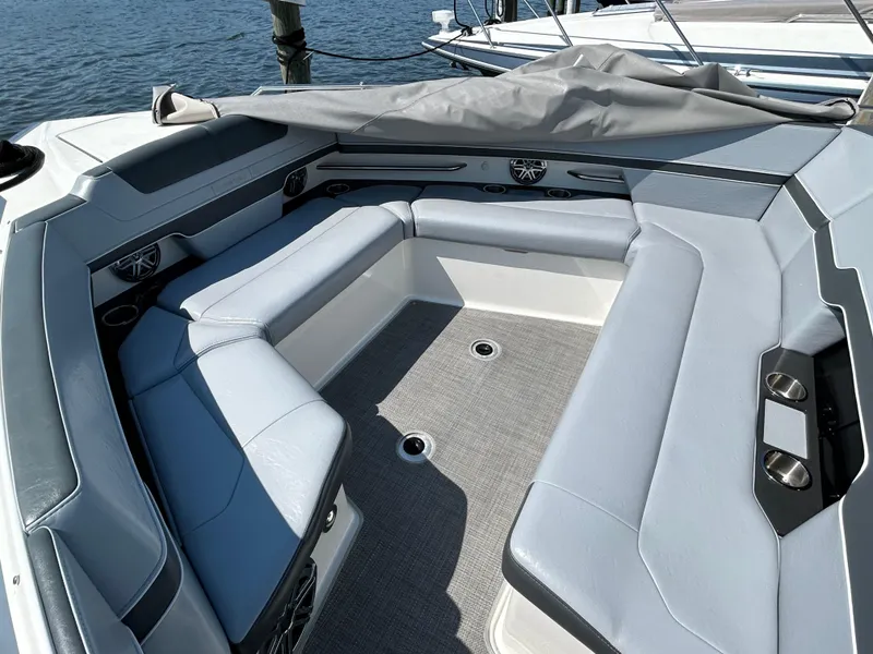 Slide: The Image of 2020 Formula 380 Super Sport Crossover boat interior with gray seating and open water view. - 15