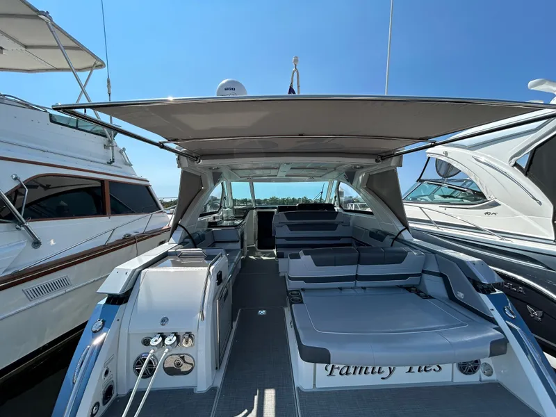 Slide: The Image of 2020 Formula 380 Super Sport Crossover yacht with spacious deck and seating area. - 18