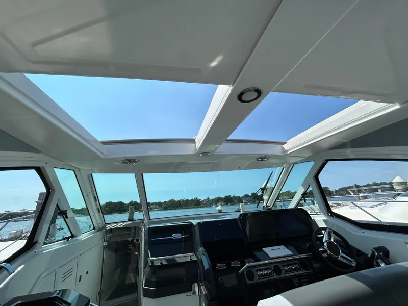 Slide: The Image of 2020 Formula 380 Super Sport Crossover cockpit with panoramic windows and modern controls. - 21