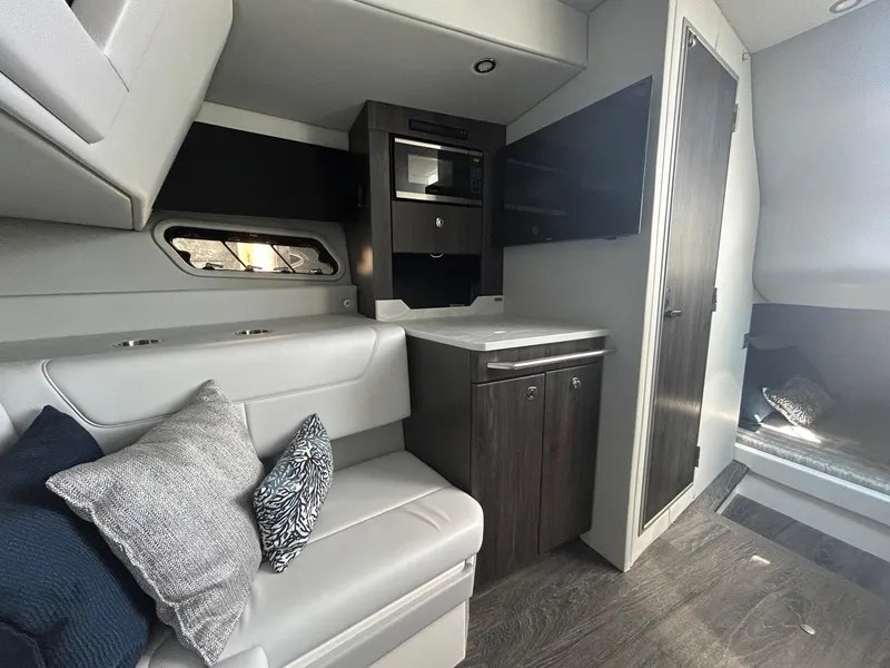 Slide: The Image of 2020 Formula 380 Super Sport Crossover interior with modern seating and cabinetry. - 24