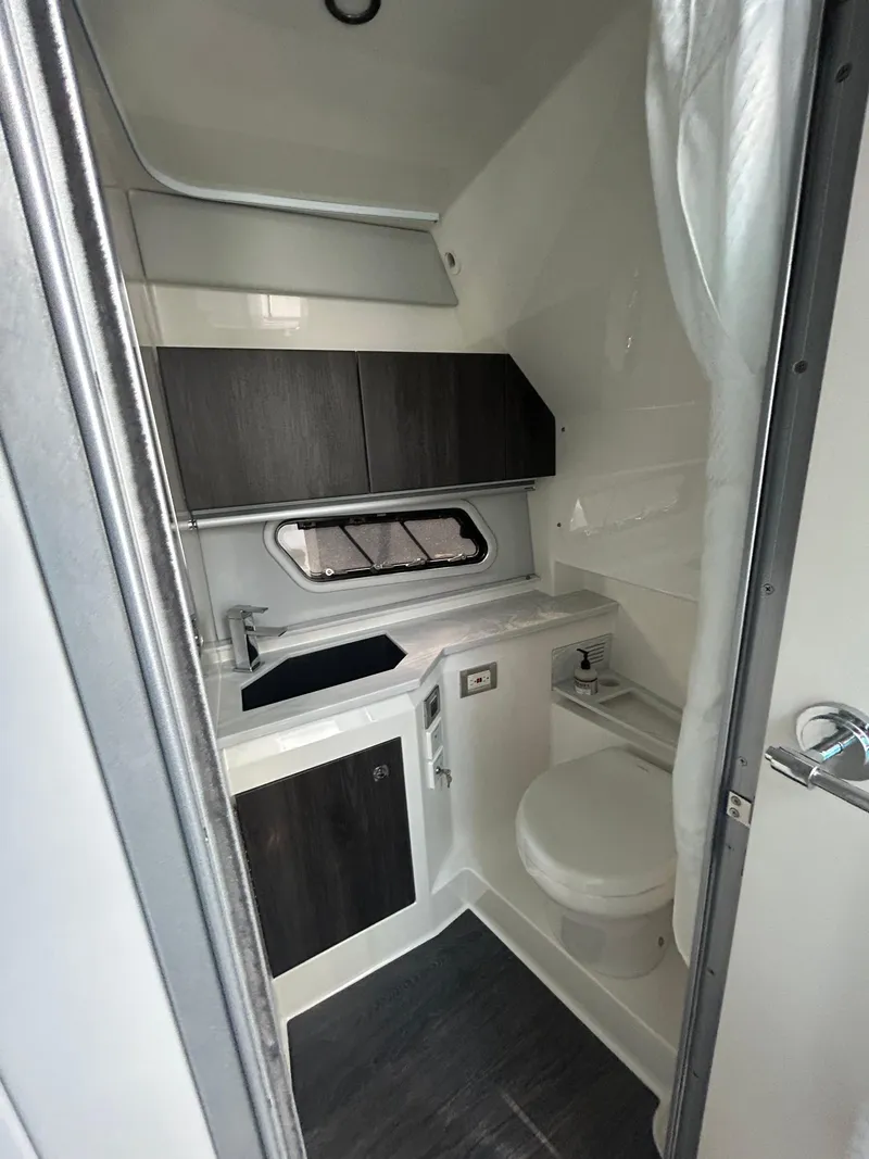 Slide: The Image of 2020 Formula 380 Super Sport Crossover bathroom interior with modern fixtures and cabinetry. - 28