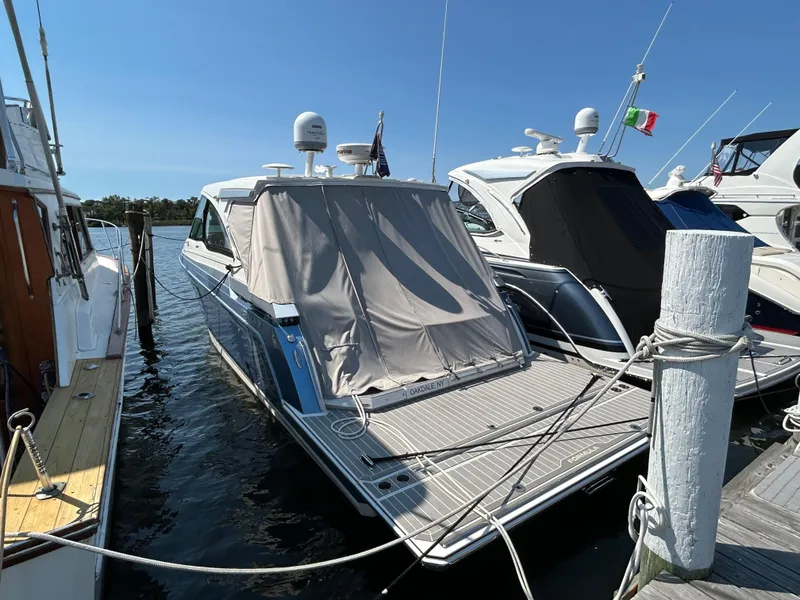 Slide: The Image of 2020 Formula 380 Super Sport Crossover docked at marina, rear view. - 3