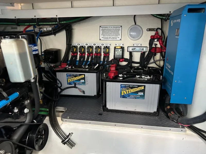 Slide: The Image of 2020 Formula 380 Super Sport Crossover engine compartment with batteries and electrical components. - 31