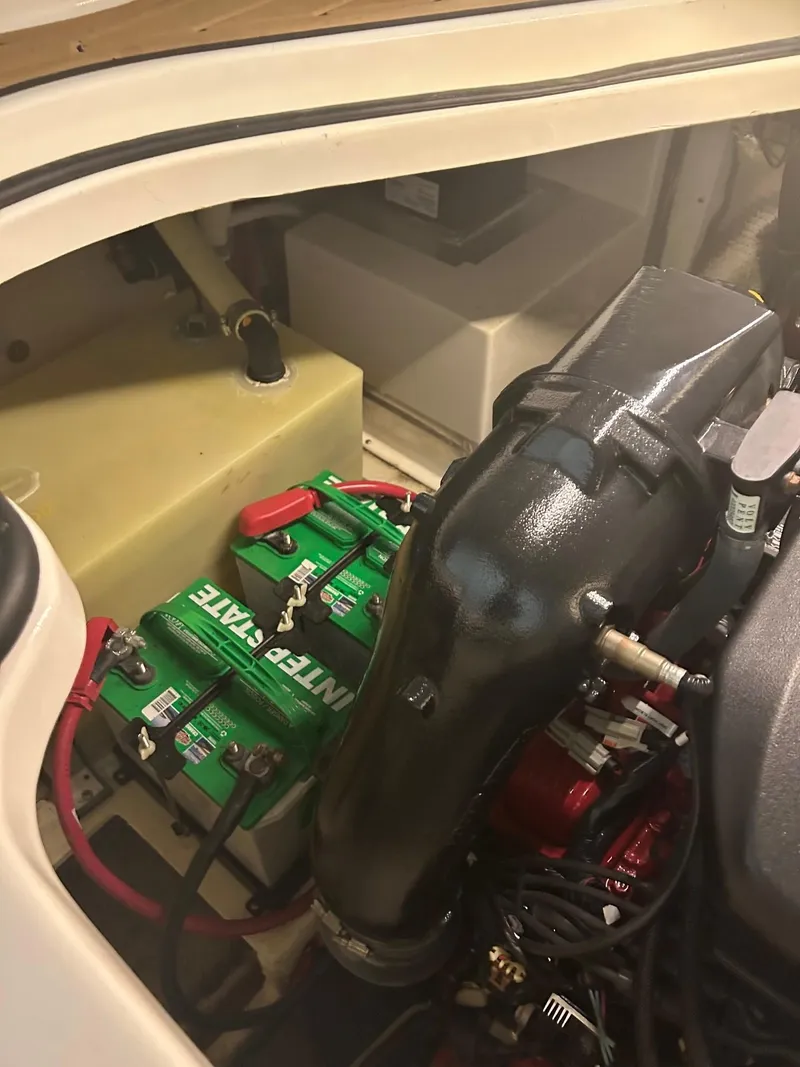 Slide: The Image of 2014 Regal 28 Express engine compartment with battery and components. - 5