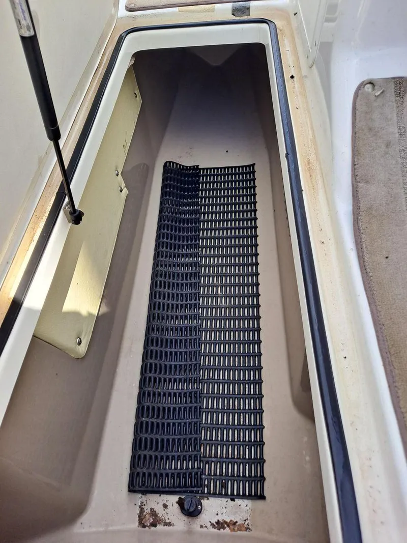 Slide: The Image of Storage compartment of 2013 Yamaha Boats 242 Limited S with black mat. - 14