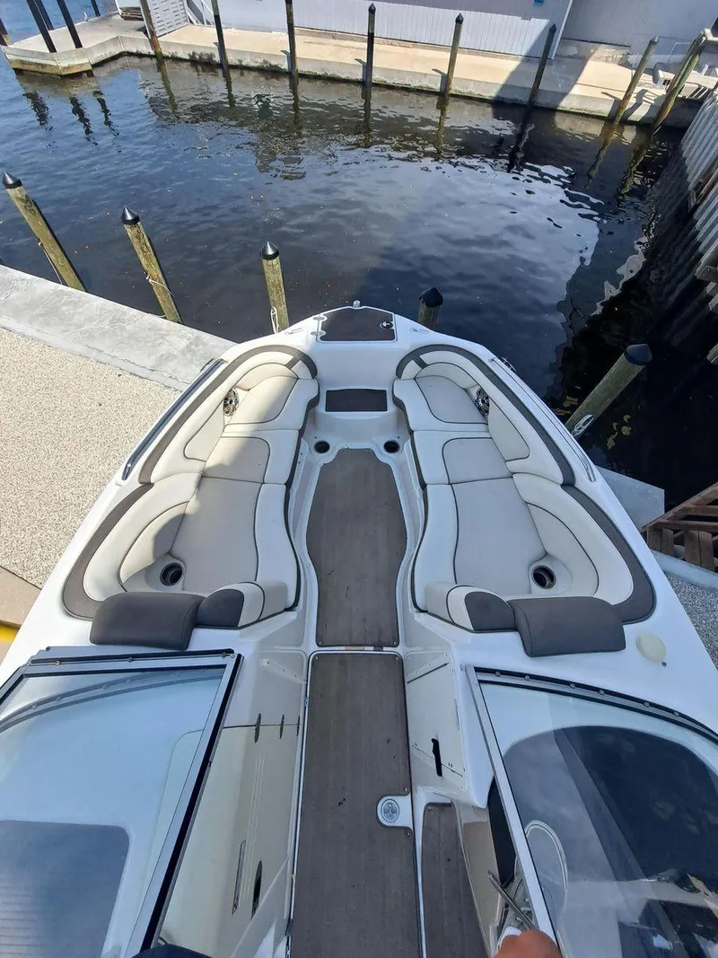 Slide: The Image of 2013 Yamaha Boats 242 Limited S, spacious deck view at marina. - 24