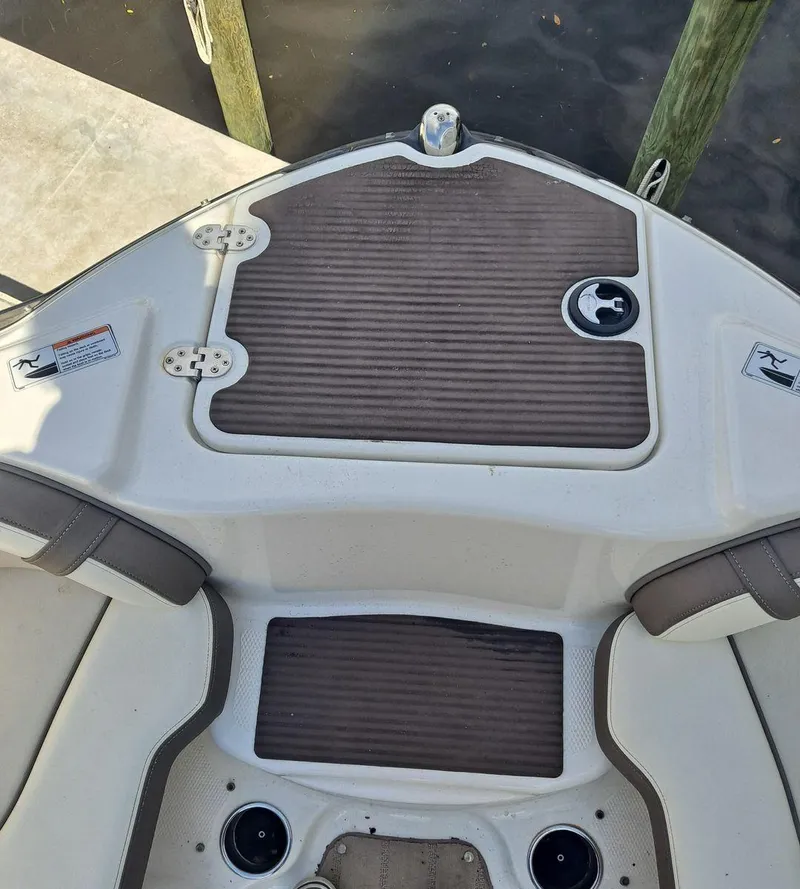 Slide: The Image of 2013 Yamaha Boats 242 Limited S deck, featuring seating and cup holders. - 25