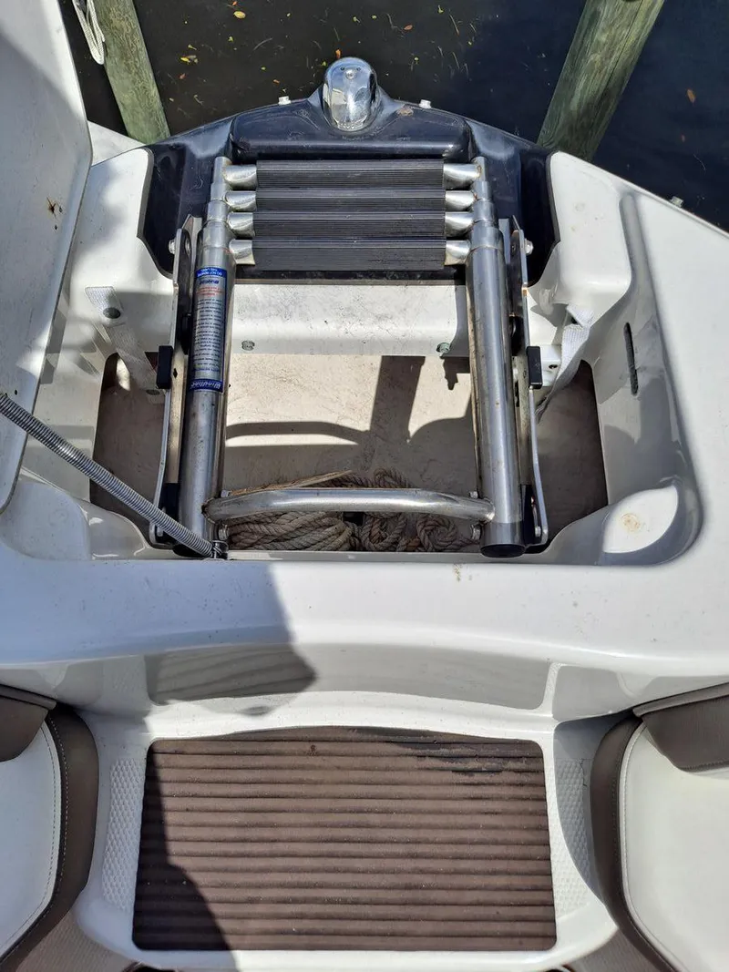 Slide: The Image of 2013 Yamaha Boats 242 Limited S swim platform with retractable ladder. - 26