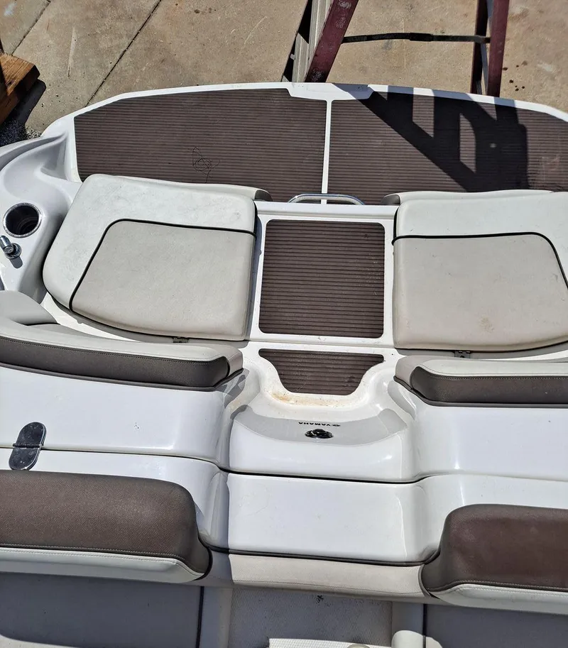 Slide: The Image of 2013 Yamaha Boats 242 Limited S interior seating area with cushioned seats and cup holder. - 29
