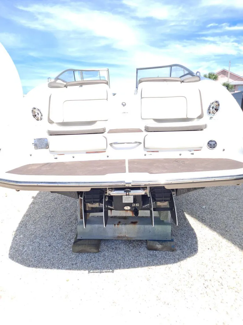 Slide: The Image of 2013 Yamaha Boats 242 Limited S, rear view, on a sunny day. - 34