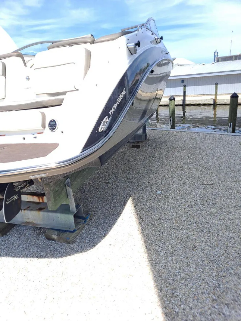 Slide: The Image of 2013 Yamaha Boats 242 Limited S on dock, side view. - 35