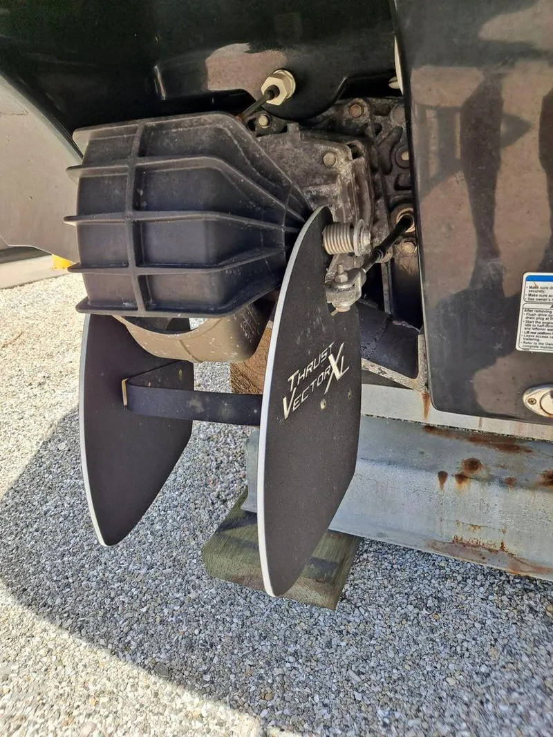 Slide: The Image of 2013 Yamaha Boats 242 Limited S propeller detail on gravel surface. - 37