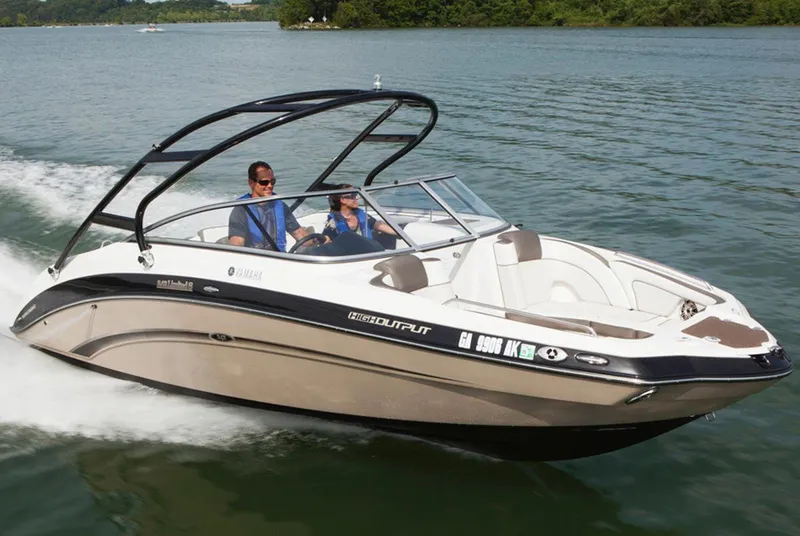 Slide: The Image of 2013 Yamaha Boats 242 Limited S cruising on a lake with two passengers. - 40