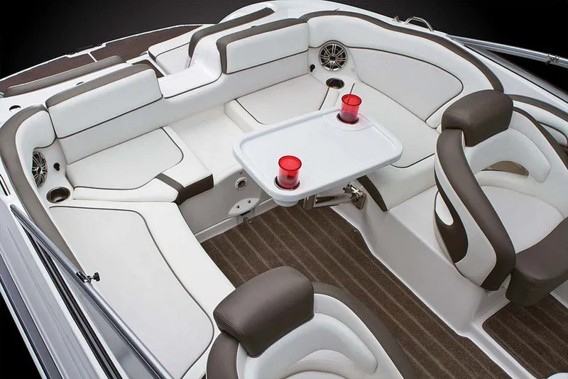 Slide: The Image of 2013 Yamaha Boats 242 Limited S interior with seating and table, featuring modern design. - 42