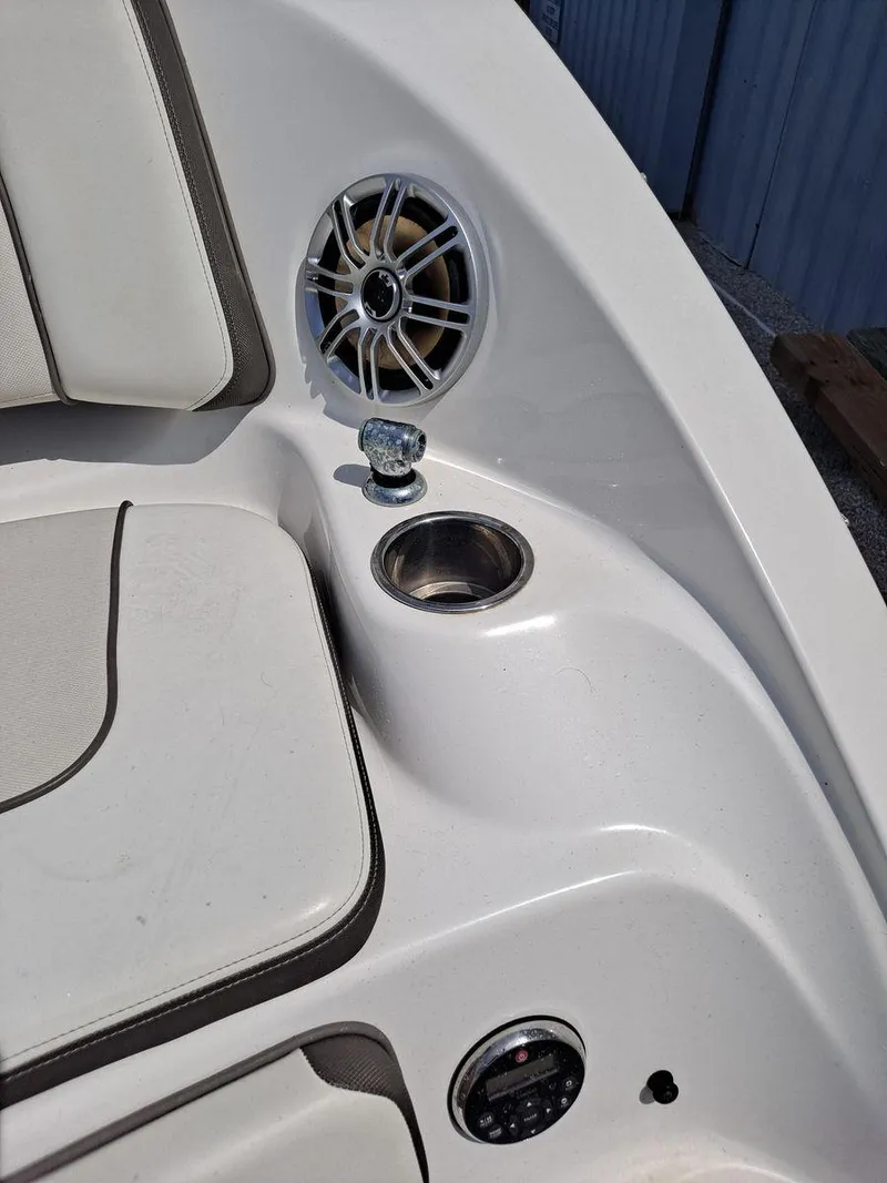 Slide: The Image of 2013 Yamaha Boats 242 Limited S interior with speaker and cup holder. - 5