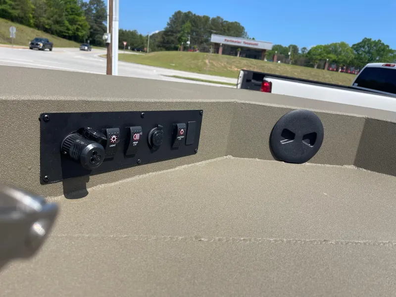 Slide: The Image of Control panel on 2024 Thor 1900 Lake Hammer CenterConsole boat, outdoors in a parking area. - 6