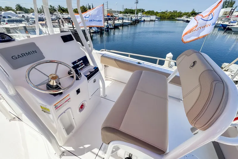 Slide: The Image of Edgewater 208CC 2025 helm with Garmin system. - 1