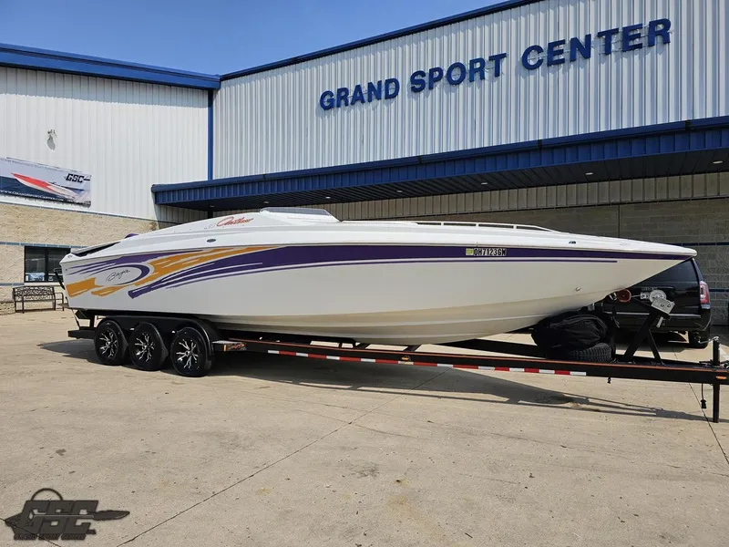 Slide: The Image of 2004 Baja 30 Outlaw boat on trailer at Grand Sport Center. - 14