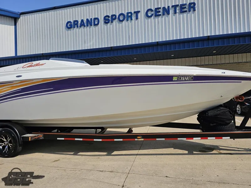 Slide: The Image of 2004 Baja 30 Outlaw boat on trailer at Grand Sport Center. - 15