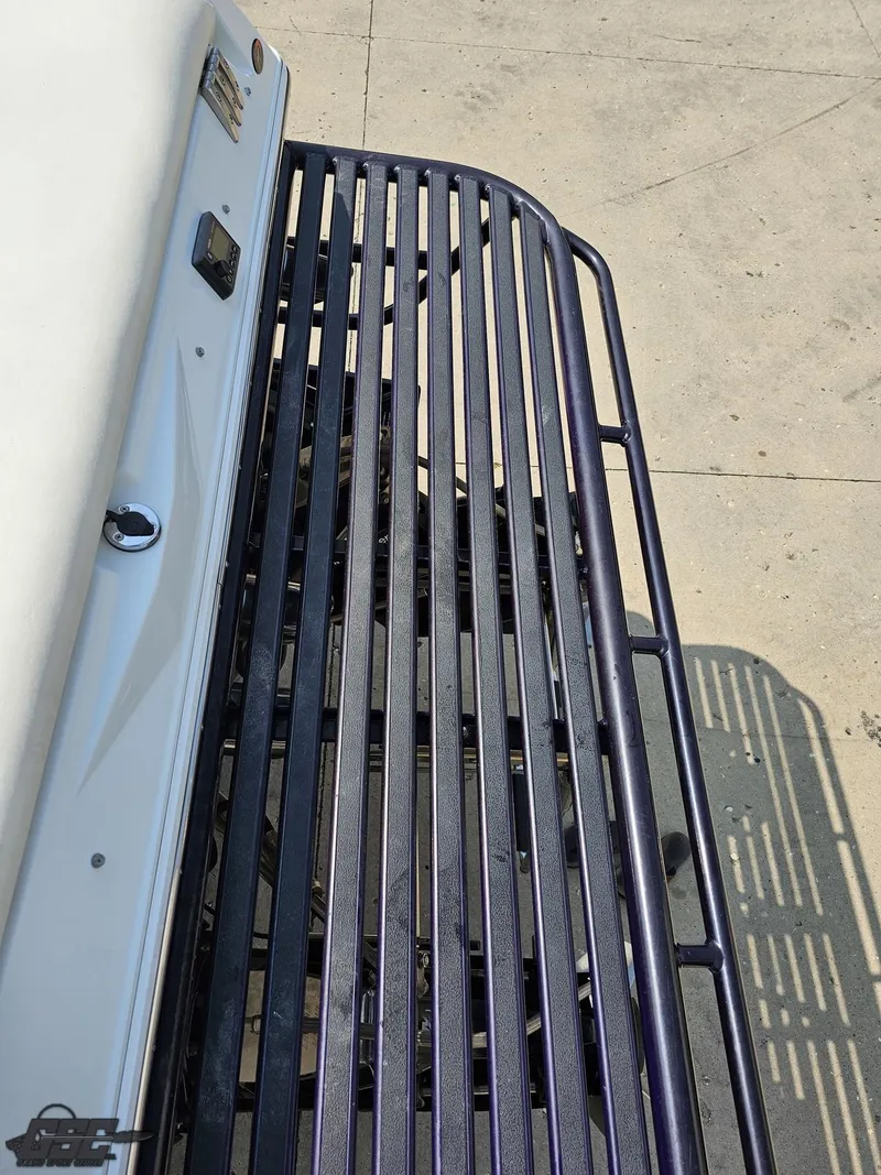 Slide: The Image of 2004 Baja 30 Outlaw boat deck with metal railing. - 40