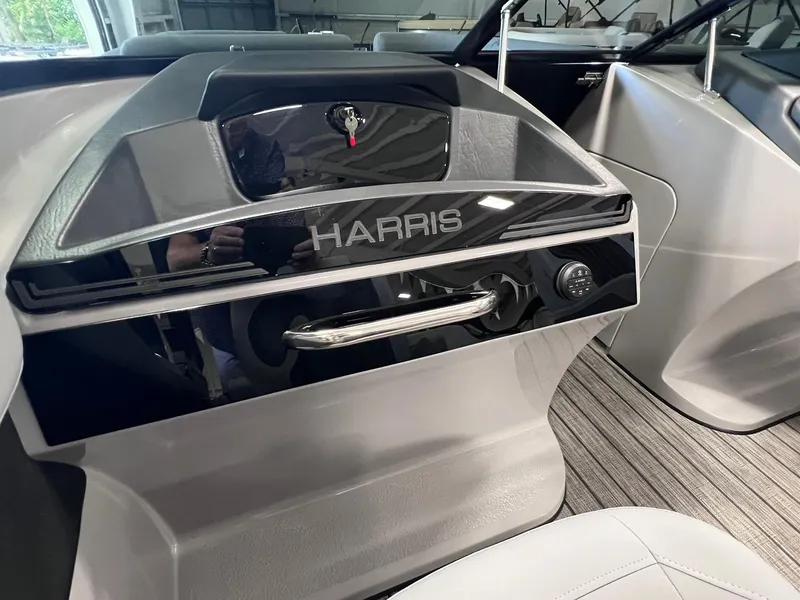 Slide: The Image of 2025 Harris Solstice DC 250 boat interior with sleek dashboard design. - 10