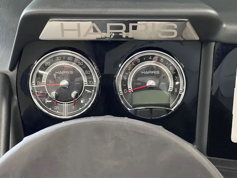 Slide: The Image of Dashboard of 2025 Harris Solstice DC 250 boat with speedometer and tachometer. - 13