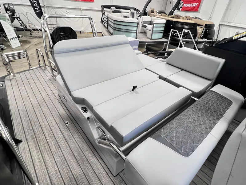 Slide: The Image of 2025 Harris Solstice DC 250 boat interior with sleek gray seating and modern design. - 22