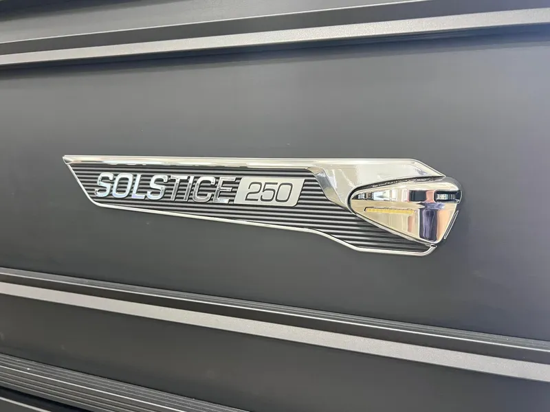 Slide: The Image of 2025 Harris Solstice DC 250 emblem on sleek black surface. - 28