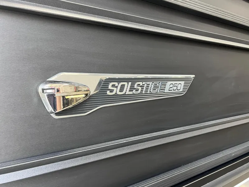 Slide: The Image of 2025 Harris Solstice DC 250 emblem on sleek black surface. - 29