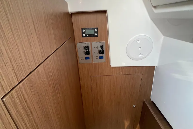Slide: The Image of Control panel inside 2022 Beneteau Antares 11 boat, featuring wood finish and modern design. - 10