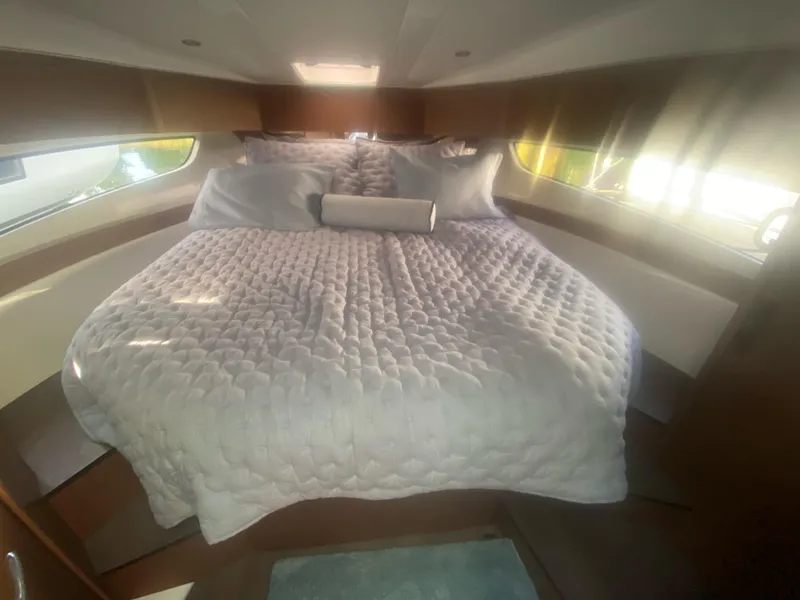 Slide: The Image of Luxurious cabin interior of 2022 Beneteau Antares 11 with cozy bedding. - 25