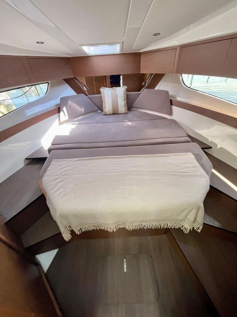 Slide: The Image of Luxurious cabin interior of 2022 Beneteau Antares 11 yacht with elegant bedding. - 7