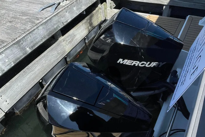 Slide: The Image of Twin Mercury outboard engines on a 2022 Beneteau Antares 11 at dock. - 8
