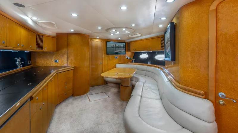 Slide: The Image of Luxurious interior of 1999 Sunseeker Predator 58 yacht with elegant wood finishes and plush seating. - 18