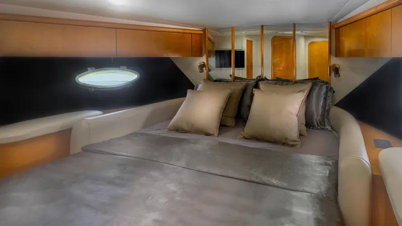 Slide: The Image of Luxurious cabin interior of 1999 Sunseeker Predator 58 yacht with plush bedding. - 32