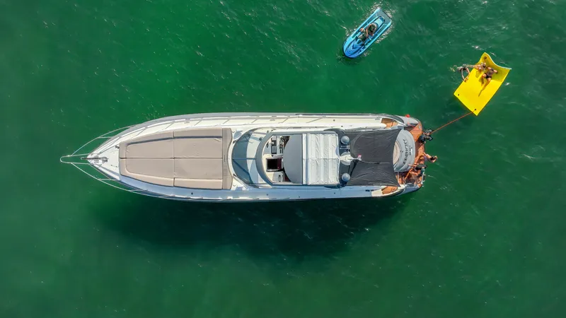Slide: The Image of Aerial view of 1999 Sunseeker Predator 58 yacht with paddleboard and floating mat. - 42