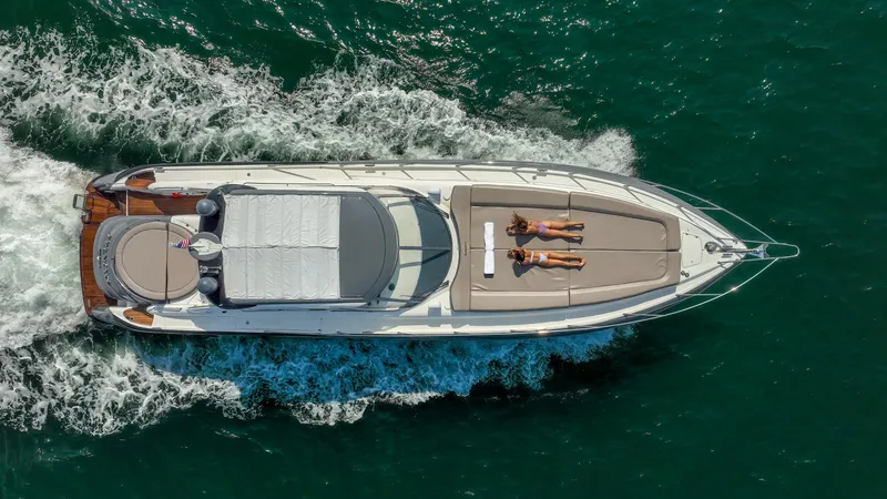 Slide: The Image of Aerial view of 1999 Sunseeker Predator 58 yacht cruising on the ocean. - 5