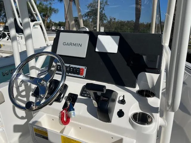 Slide: The Image of 2025 Key West 189 FS boat console with Garmin navigation system and steering wheel. - 3