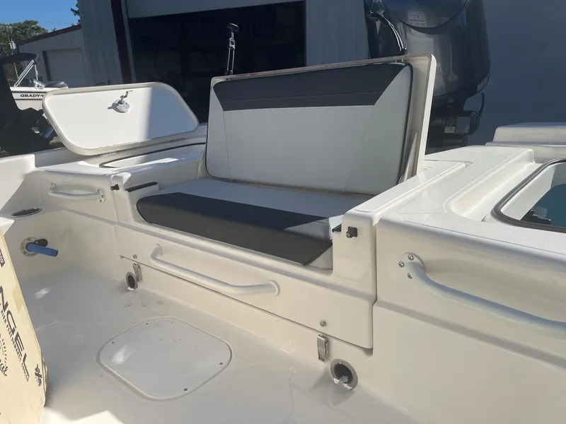 Slide: The Image of Skeeter SX221 2025 boat with ladder and motor, parked on a trailer. - 10